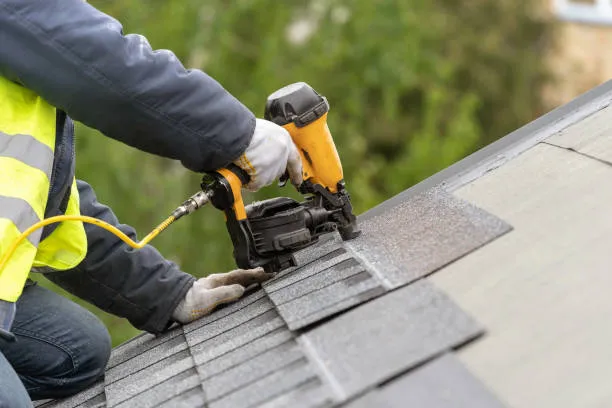 a man repairing roof